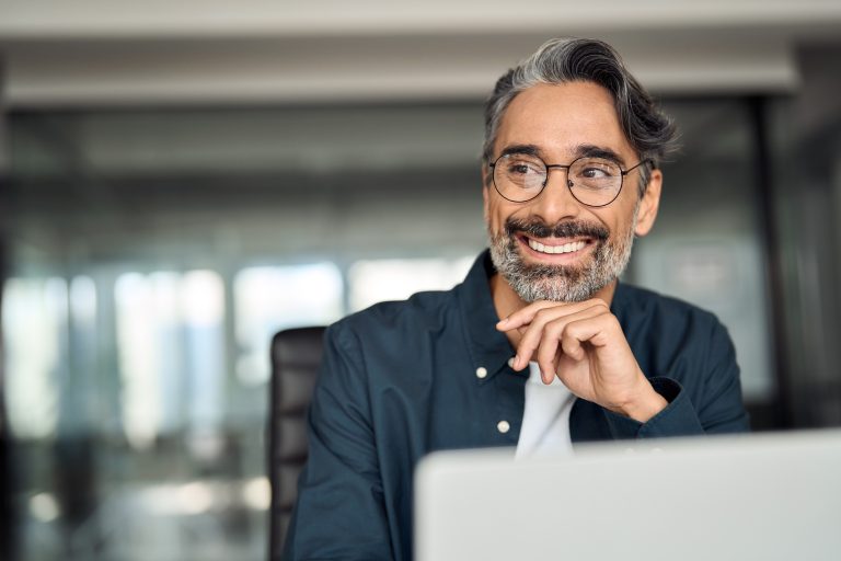 Smiling,Mature,Business,Man,Executive,Wearing,Shirt,Sitting,At,Desk